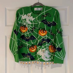Unique Halloween sweater with pumpkin, ghosts, bats and spider appliqués.